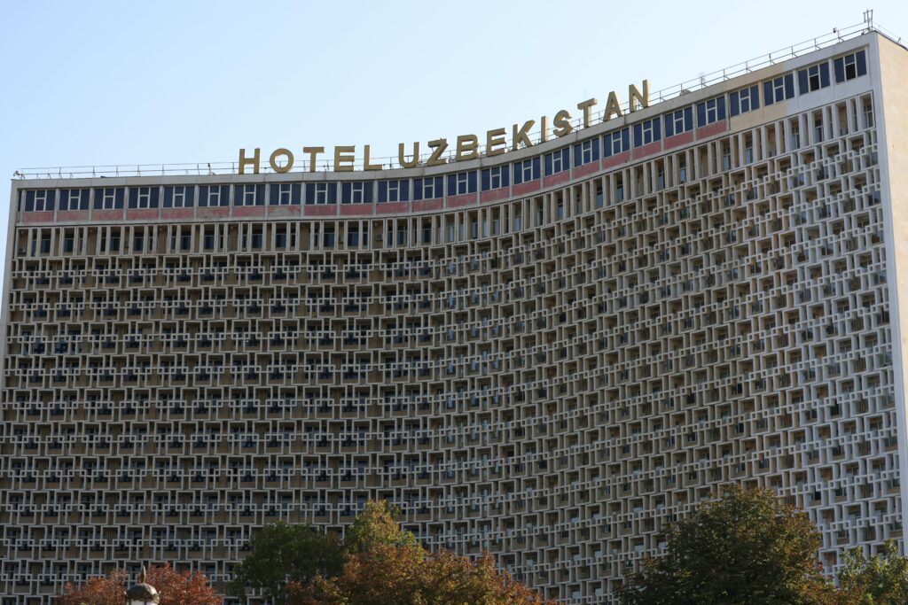 Modern facade of Hotel Uzbekistan in Tashkent, showcasing unique architectural elements.